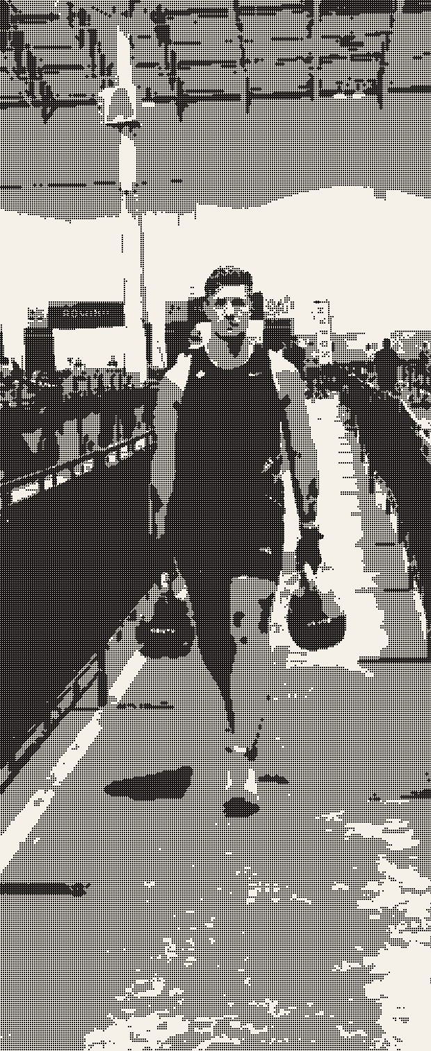 An athlete carrying kettlebells down the race venue track, dithered